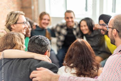 Obraz na płótnie Diverse group hugging joyfully