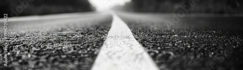 A white strip on the asphalt road, close up