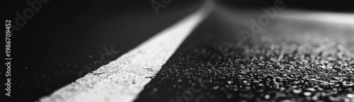 A white strip on the asphalt road, close up