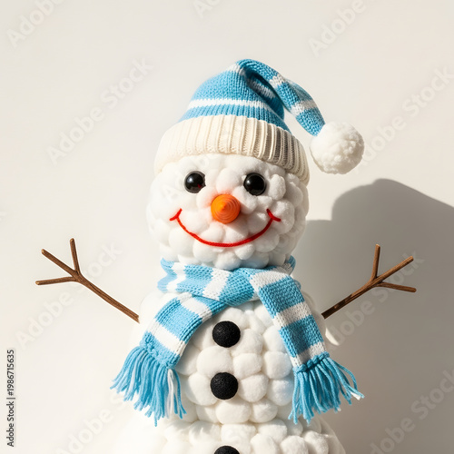 Cute handmade snowman with blue striped hat and scarf, isolated on transparent background