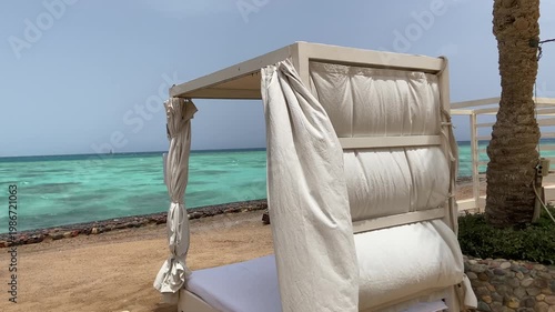 Luxury Beach Cabana with Lounger and Curtains on Tropical Shore, Relax and holiday
