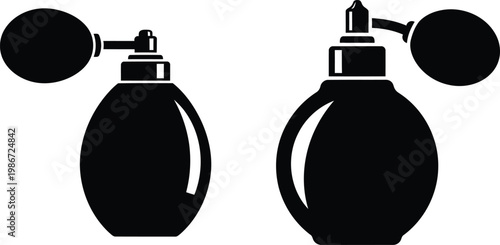 Two perfume bottles with sprayers on white background