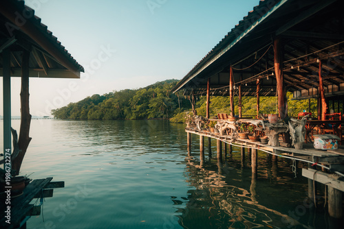 Authentic Overwater Wooden House and Floating Fishing Raft in Tropical Bay