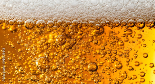 Refreshing Amber Ale With Bubbly Foam And Golden Bubbles - Close Up Macro Shot