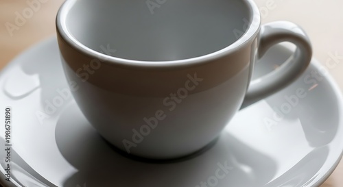 Empty white ceramic coffee cup saucer.
