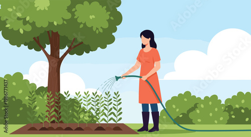 Dedicated female gardener in an orange dress and boots uses a garden hose to water a neat row of green plants in the backyard.