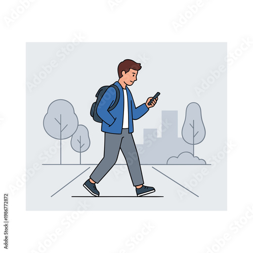 Young man walking down city street looking at smartphone