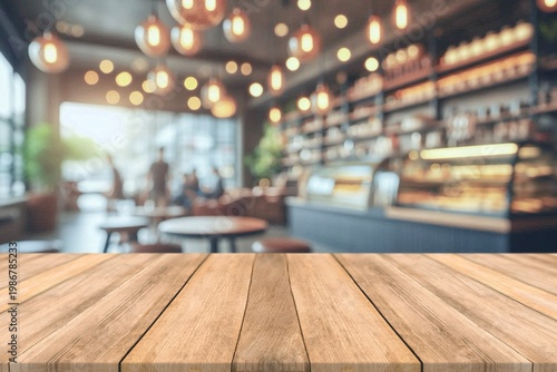 Empty wooden table top with blurred coffee shop and bokeh background for product display.