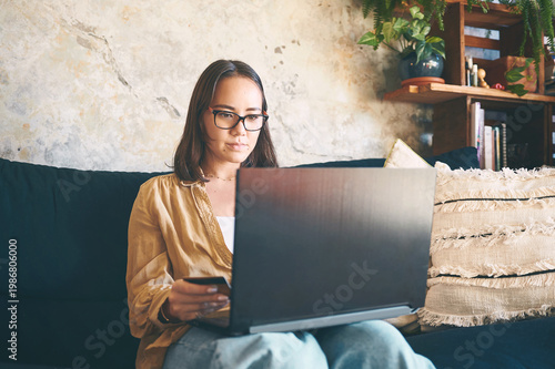фотографія Sofa, laptop or woman with credit card for online shopping, checkout payment or digital transaction
