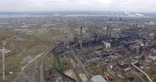 Aerial Close-up of Steelworks Releasing Smoke and Dense Piping