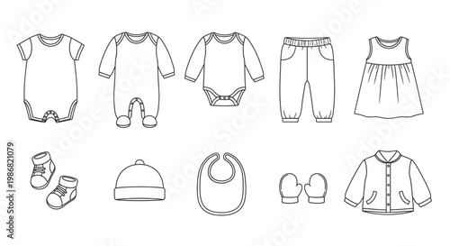 Baby clothes and accessories laid out 1.