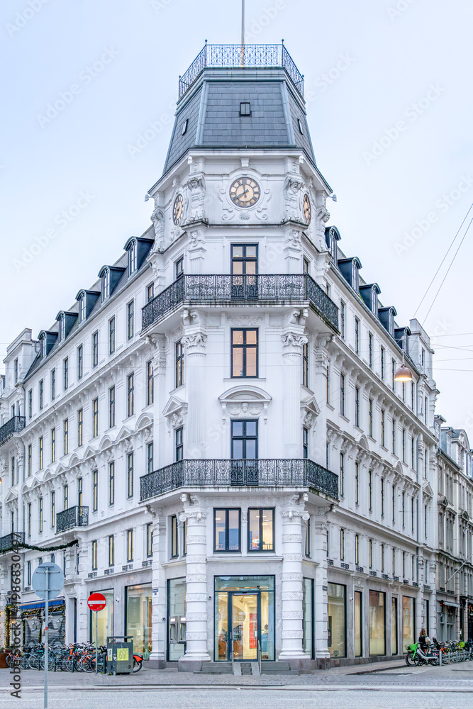 Fototapeta premium Historic Corner Building and Clock Tower, Kongens Nytorv, Copenhagen, Denmark