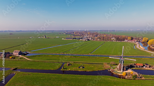 Three traditional windmills in rural landscape in Europe