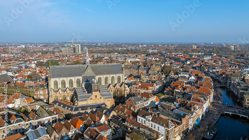 Historic canal city with prominent church tower in Europe