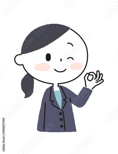 OKサインを出して微笑むスーツ姿の女性