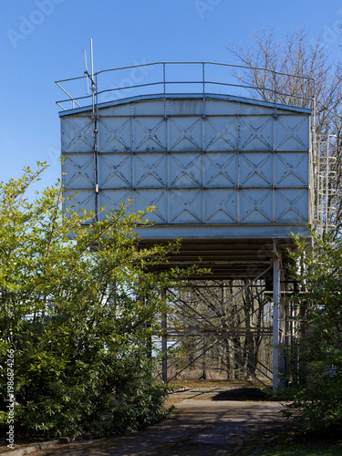 The Historical Steel Water Tanks at Stracathro Hospital Entrance, showing the riveted metal panels used in the construction
