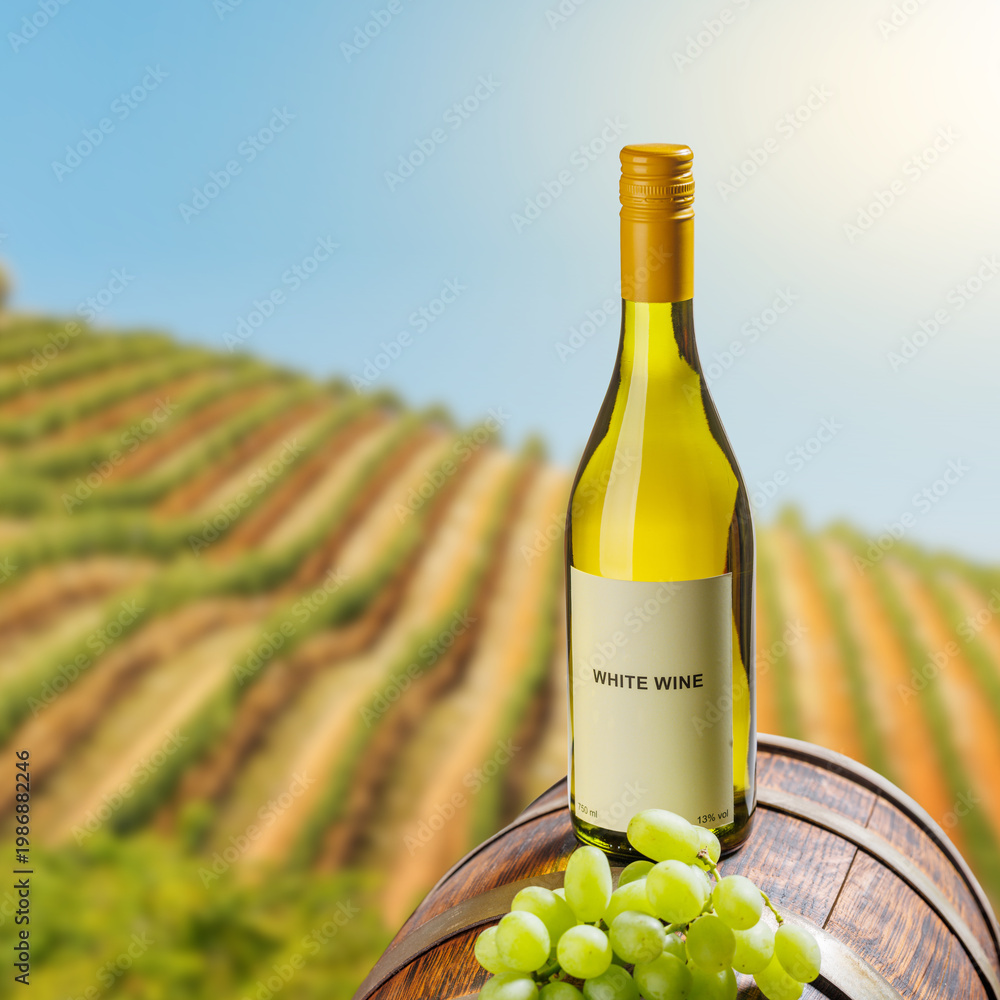 Fototapeta premium White wine bottle with grapes