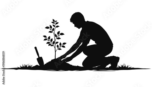 Silhouette of man planting a young tree sapling in soil representing environmental conservation sustainability growth and care for nature