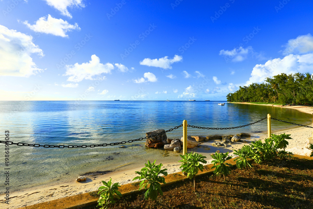 Fototapeta premium Paradise Tropical Beach with Blue Sky and White Clouds