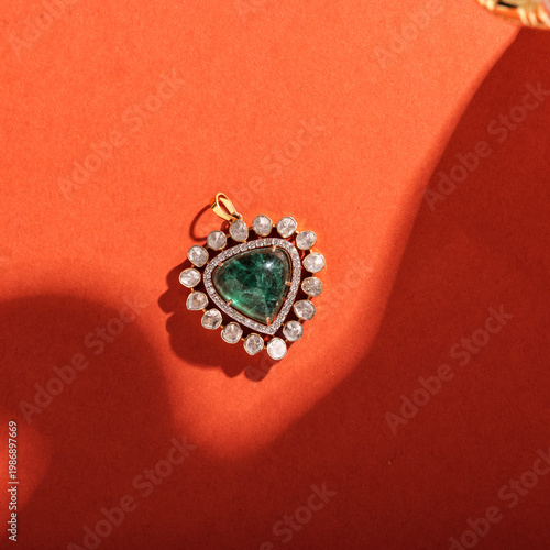 Canvas Print Exquisite gold jewelry set featuring an ornate emerald pendant and matching earrings