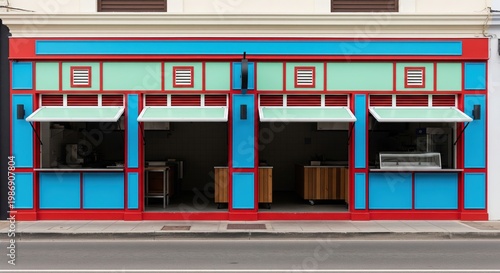 Colorful shopfront in urban setting during daytime. Contemporary food establishment with unique design. Business opportunity, commercial property, trendy facade.