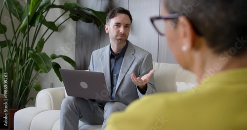 Financial advisor in a meeting with a customer on Sofa