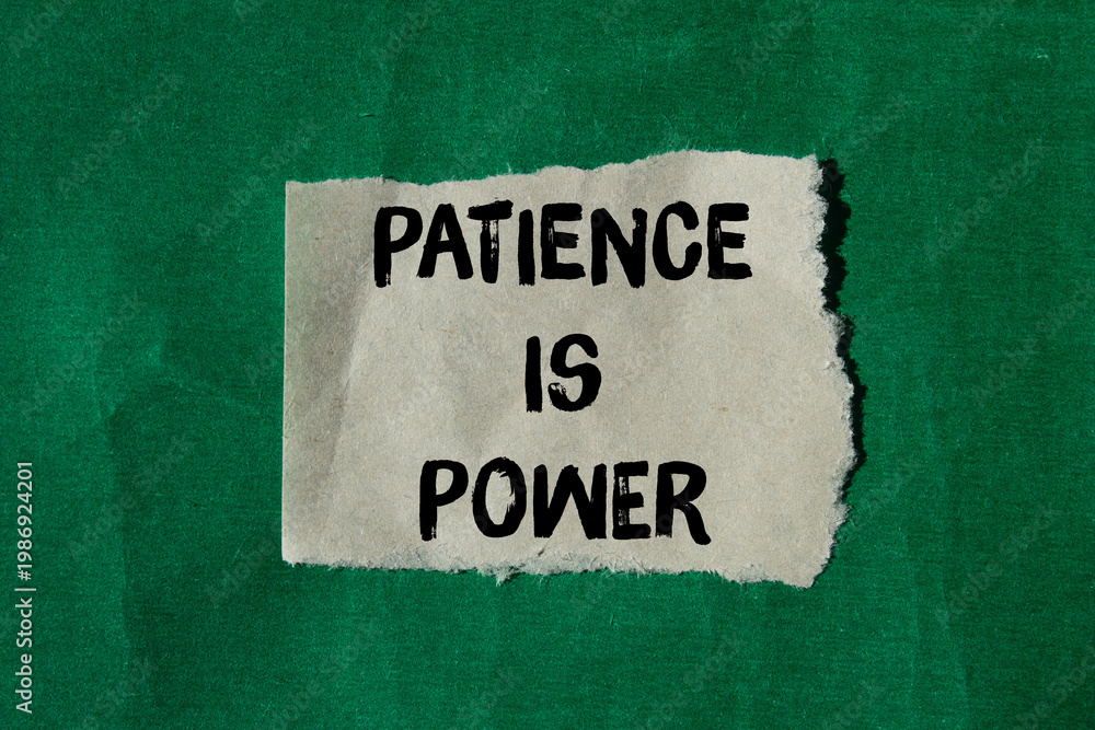 Fototapeta premium Patience is power message written on ripped torn paper background. Conceptual Patience is power symbol. Copy space.