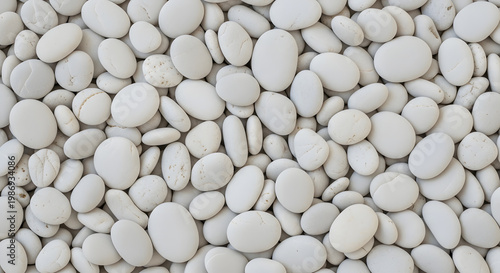 A Close-Up Overhead View of a Smooth, Round White Pebble Pile Perfect for Backgrounds