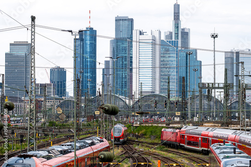 Urban transport scene with train and railway tracks in bankenviertel frankfurt germany where skyline infrastructure meets daily commuting