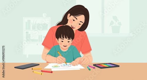 Mother and son doing an art activity at home during afternoon time