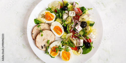 Healthy Salad with Boiled Eggs and Vegetables on White Background. Overhead, flat lay