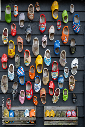 Quadro su tela Zaandam, Netherlands - 25 May 24: Colorful Dutch clogs arranged on wall display