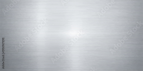 Polished silver brushed metal plate with a shiny industrial stainless steel texture and grey aluminum surface pattern for a metallic alloy backdrop