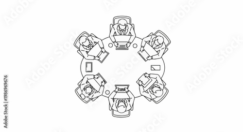 Overhead view of diverse professionals in a meeting around a circular table