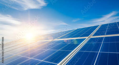 Close up of solar panels absorbing bright sunlight under a clear blue sky