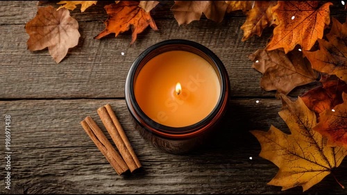 Creating a Rich Autumn Atmosphere With a Seasonal Orange Candle in a Flat Lay Surrounded by Leaves and Cinnamon Sticks