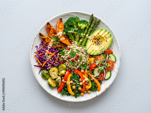 top view of vegan meal plate with colorful vegetables arranged aesthetically isolated on clean background healthy food photography composition