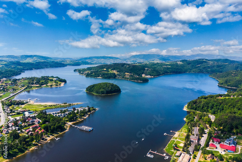 Aerial view of Grodek nad Dunajcem village, Lake Roznow and Beskidy mountains in Poland