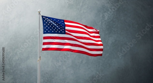American flag waving in the wind against a gray gradient background