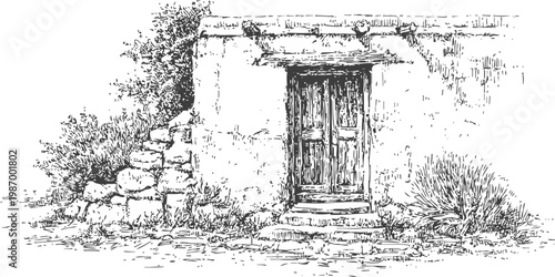 Rustic old wooden door entrance of rural stone house with surrounding plants and bushes