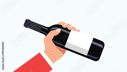 Person in a red suit sleeve holding a dark red wine bottle with a blank white label against a light background.