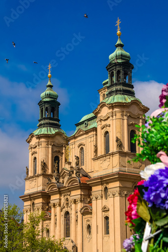 St. Nicholas Church architecture with flowers in Prague Old Town