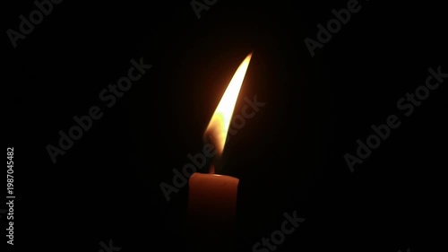 A macro shot of a flickering candle flame against a dark background, conveying a warm and cozy ambiance, loopable, looping