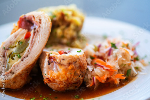Wallpaper Mural Chicken roulade, stuffed with cheese, ham and pepper, vegetable salad on white plate. Torontodigital.ca