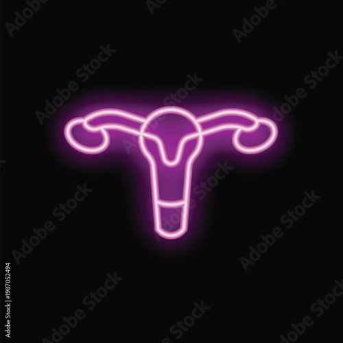 Neon pink uterus is glowing on a black background