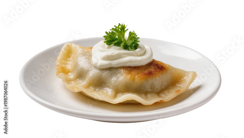 фотографія Golden pierogi topped with sour cream and parsley, isolated on transparent backg