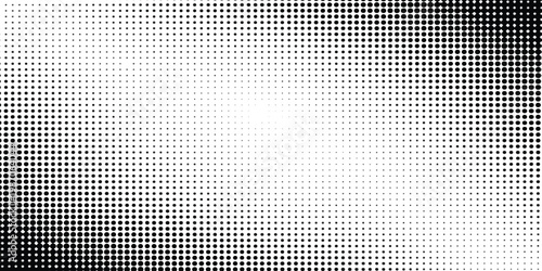 Abstract black and white halftone dot pattern texture with a central light space for copy