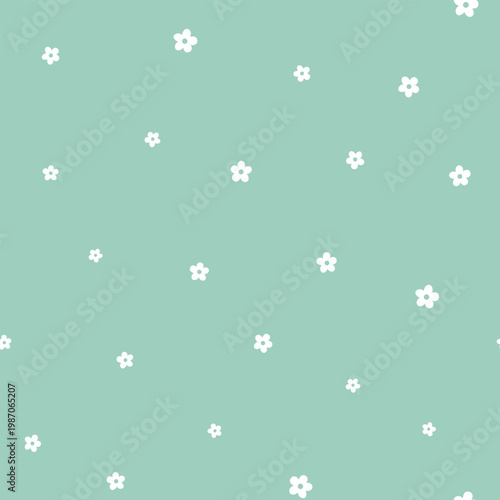 Small white flower isolated on a green background. Seamless pattern, minimalist style.  Vector background for textile, wallpaper, wrapping paper, greeting cards and decor.