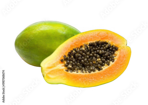 Fresh papaya fruit cut in half with seeds and green skin on white background