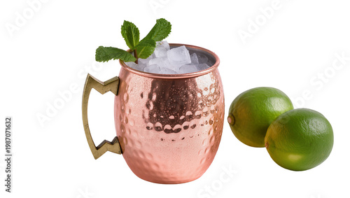 Konstfotografi Hammered copper Moscow Mule mug with ice and mint garnish, two limes isolated on